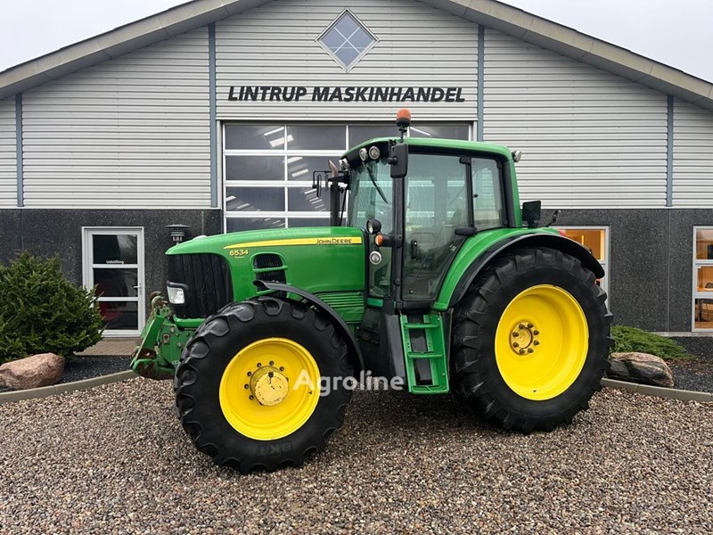 John Deere 6534 Premium med frontlift og frontPTO Ciągnik kołowy John Deere 6534 Premium med frontlift og frontPTO